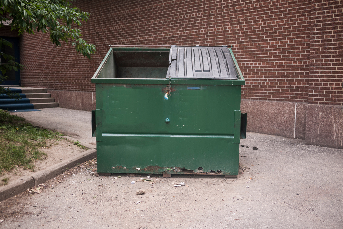 Green Garbage Dumpster